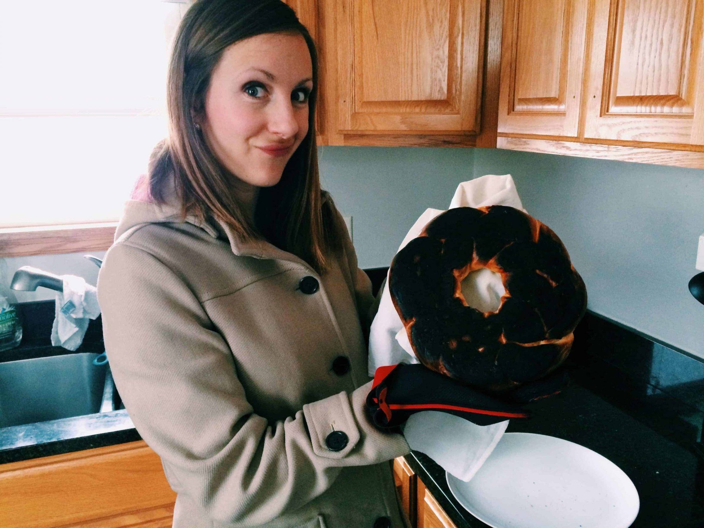 Woman holding burnt food.