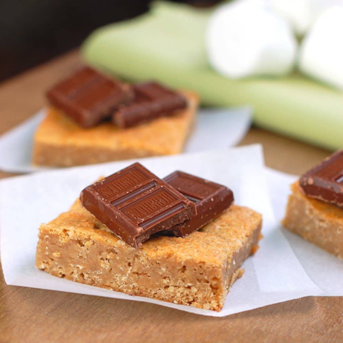Graham bars topped with melted chocolate and fluffy marshmallows.