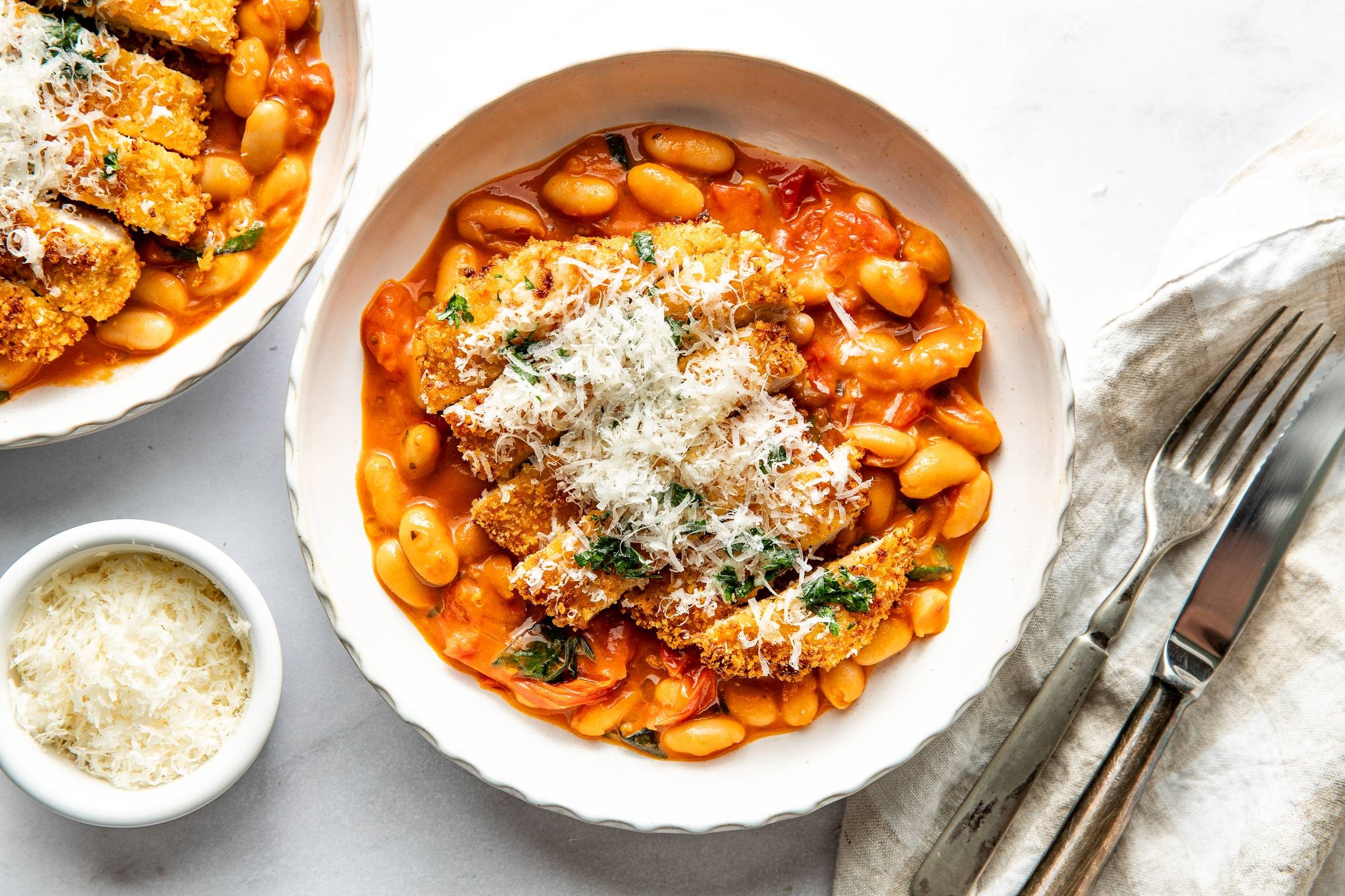 Crispy chicken on top of creamy beans.