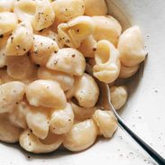 Garlic Parmesan pasta in a bowl with a spoon.