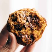 A half-bitten pumpkin muffin.